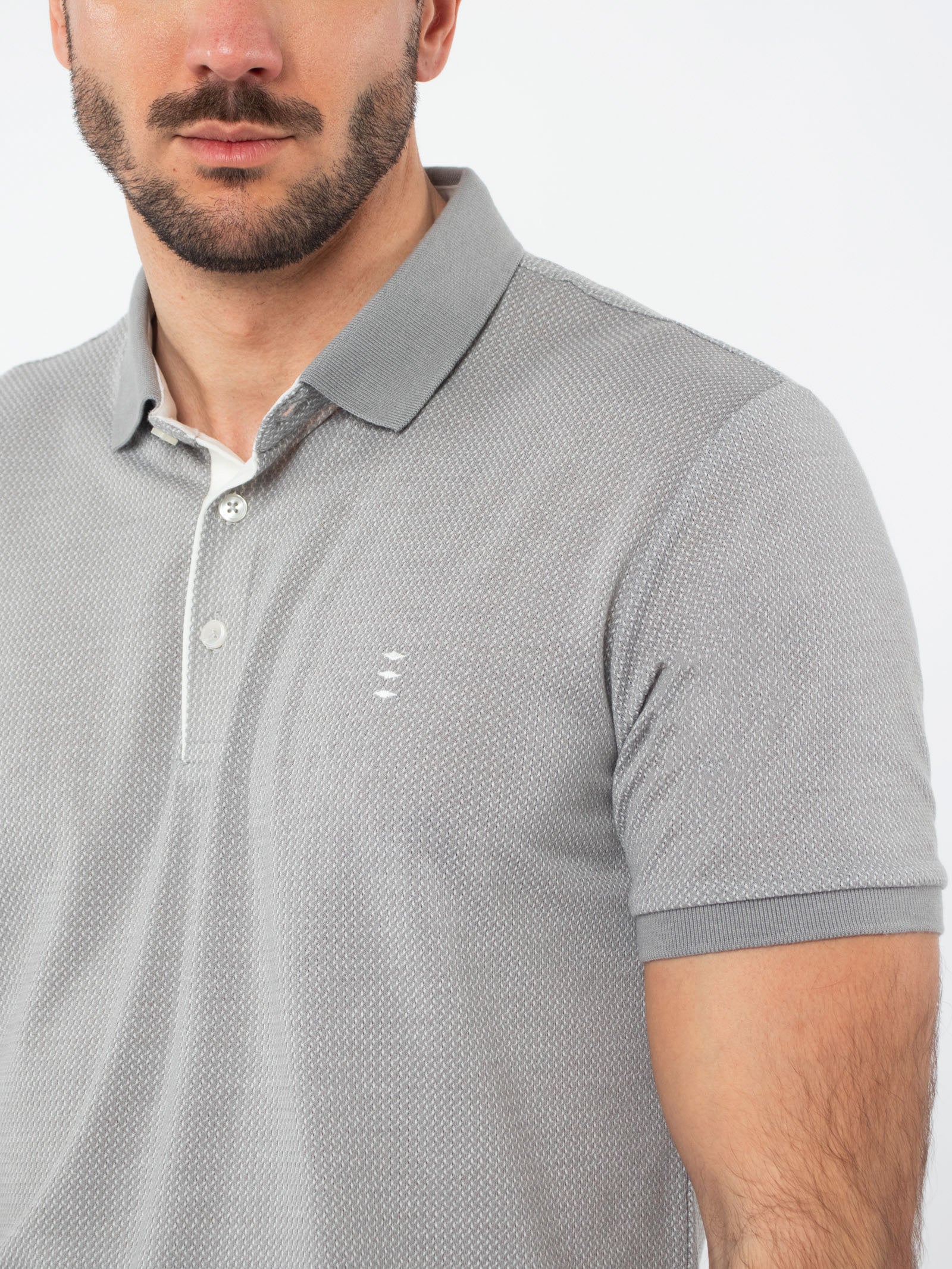 Polo jacquard con detalles